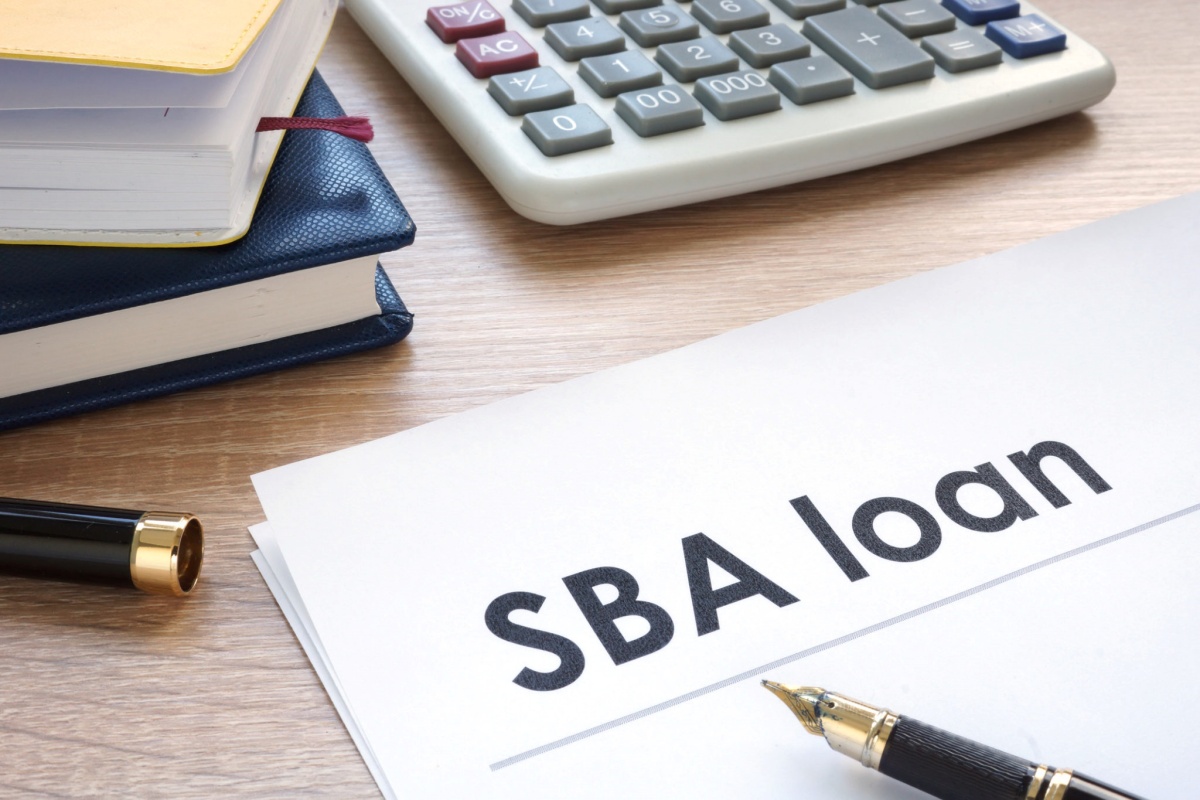 SBA Loan doc on desk representing financing for Medical Practice